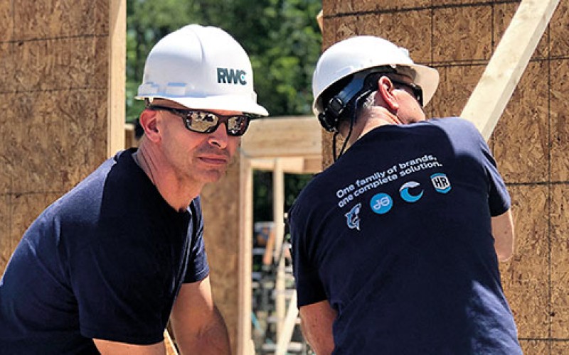 Sean McClenaghan, CEO Americas and Andrew Johnson, CFO Americas taking part in our Habitat for Humanity project.