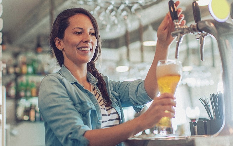 Lady pouring beer