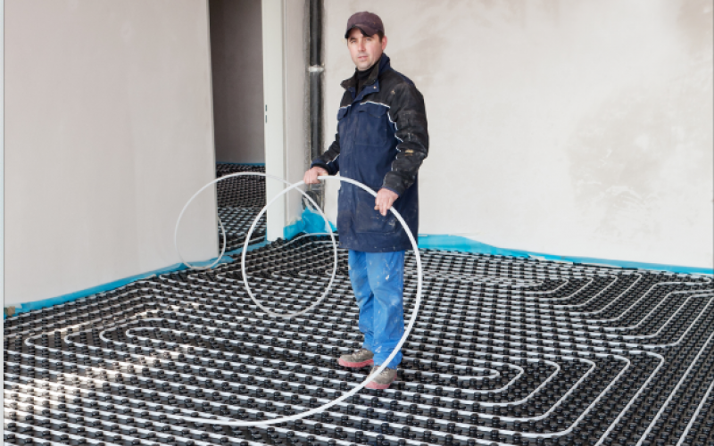 Underfloor heating pipe being laid