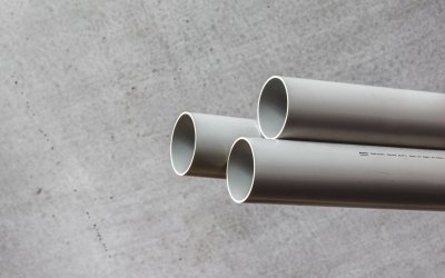 Gray PVC plumbing pipe from Holman Plumbing sections used for residential and commercial water distribution and drainage applications