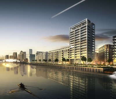 riverside view of apartment blocks along rivers edge at sunset