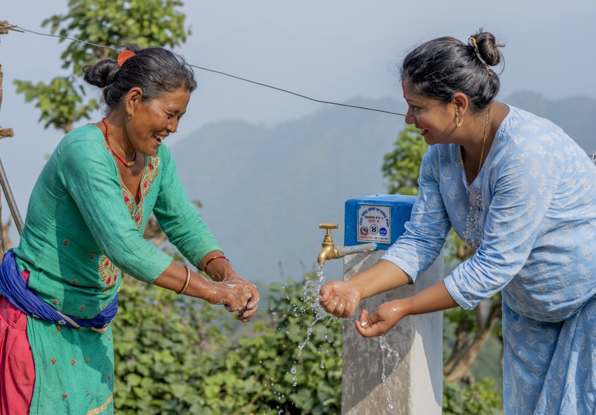 Nepali women getting water from a tap